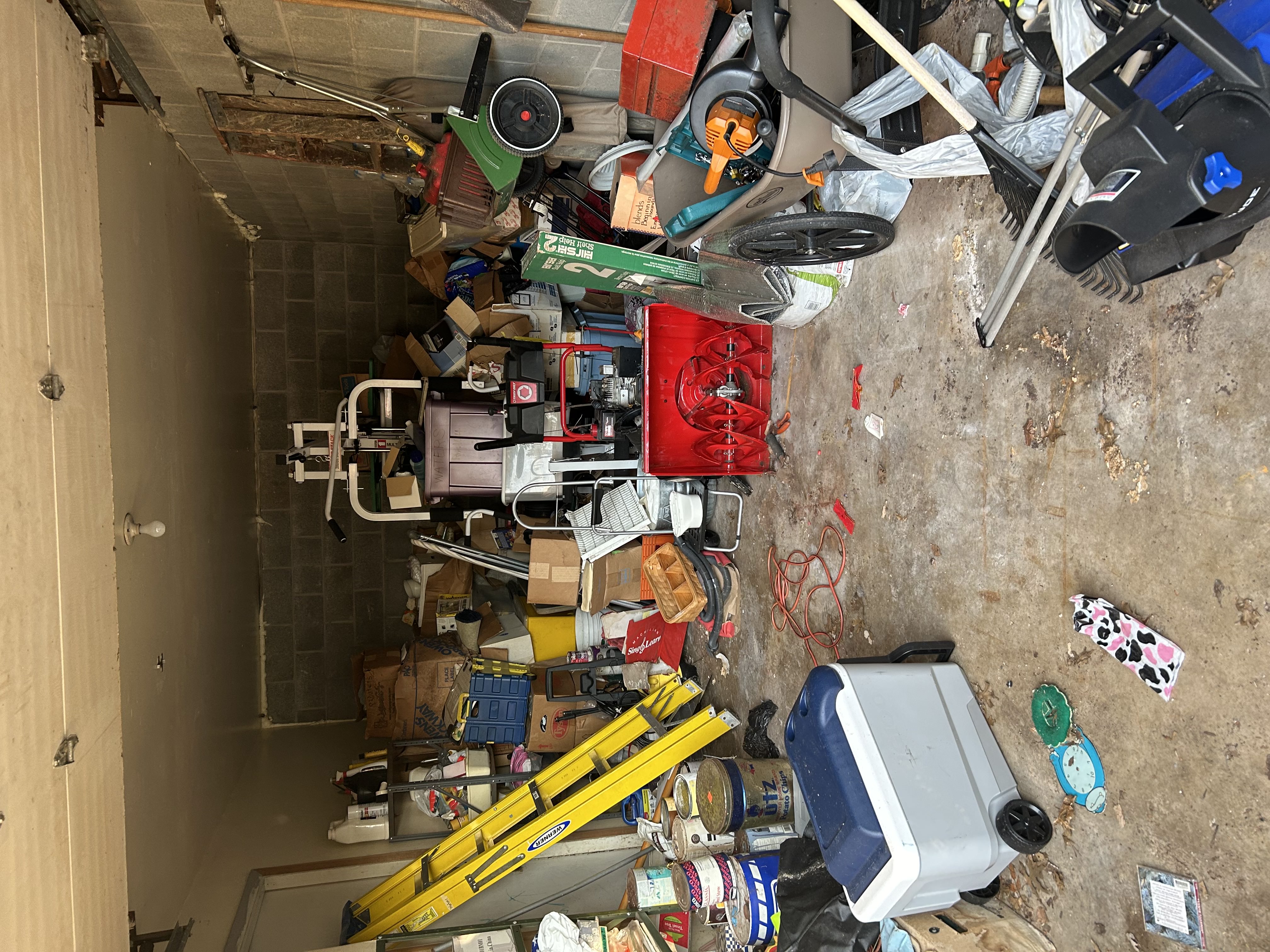 Junk Squad crew loading a trailer during a full garage cleanout in Mechanicsburg PA
